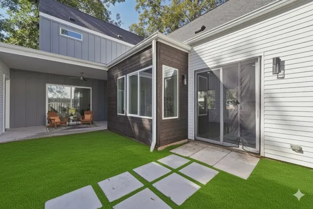 a view of backyard with patio