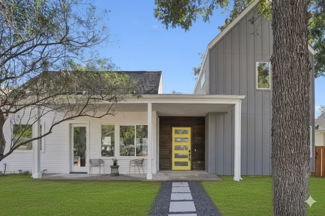 front view of a house with a yard