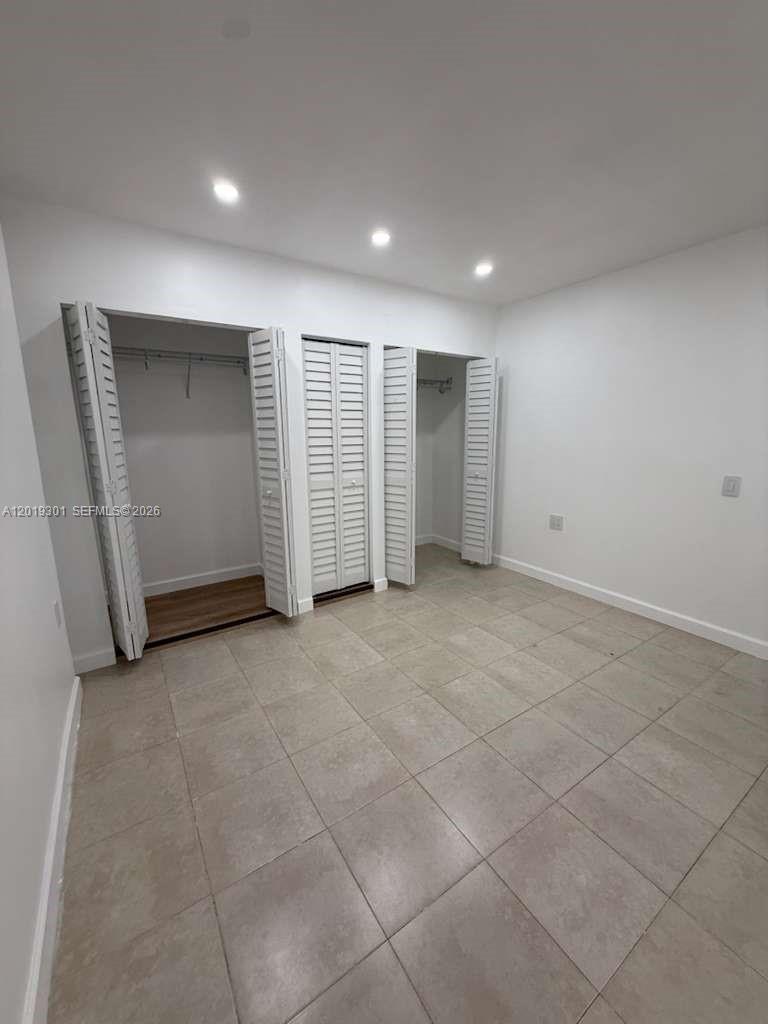 25948 Southwest 132nd Avenue, Unit 1 Homestead, FL 33032 - Photo 4 of 6 a view of an empty room