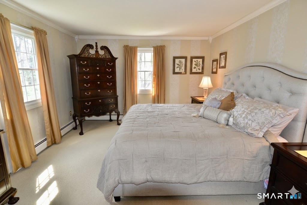 78 Mill Brook Terrace Monroe, CT 06468 - Photo 15 of 27 Wall-to-wall carpet, crown molding, walk-in closet