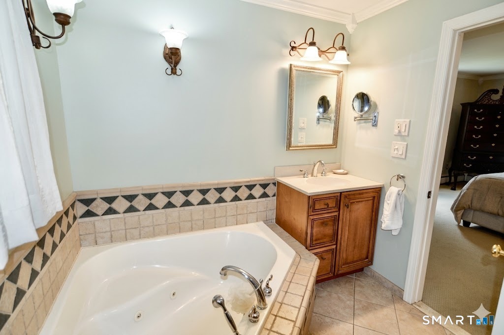 78 Mill Brook Terrace Monroe, CT 06468 - Photo 17 of 27 En-suite bath with block tile shower, soaking jetted tub and tile floor