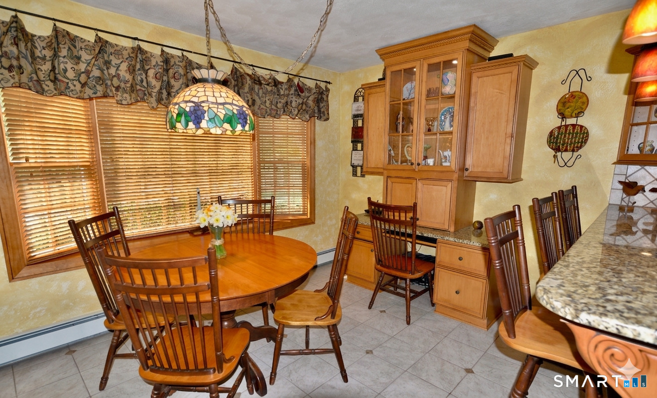 78 Mill Brook Terrace Monroe, CT 06468 - Photo 5 of 27 Dining area with a built-in desk and a bay window.
