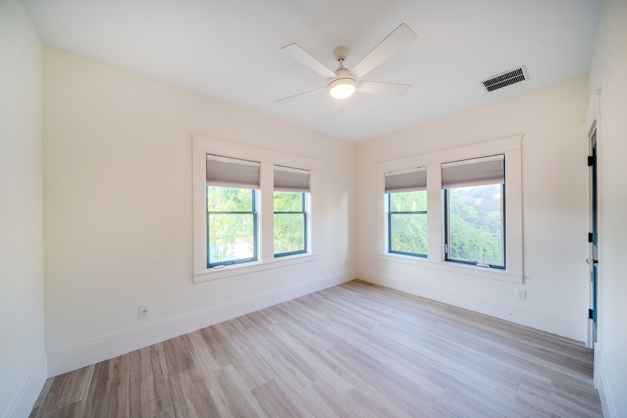 1109 Rutland Street Houston, TX 77008 - Photo 27 of 34 Bathed in sunlight, Bedroom 1 in the garage apartment offers a bright and inviting retreat. The ample natural light accentuates the room's charm, while the spacious walk-in closet ensures plenty of storage for all your essentials. A perfect blend of comfort and practicality!