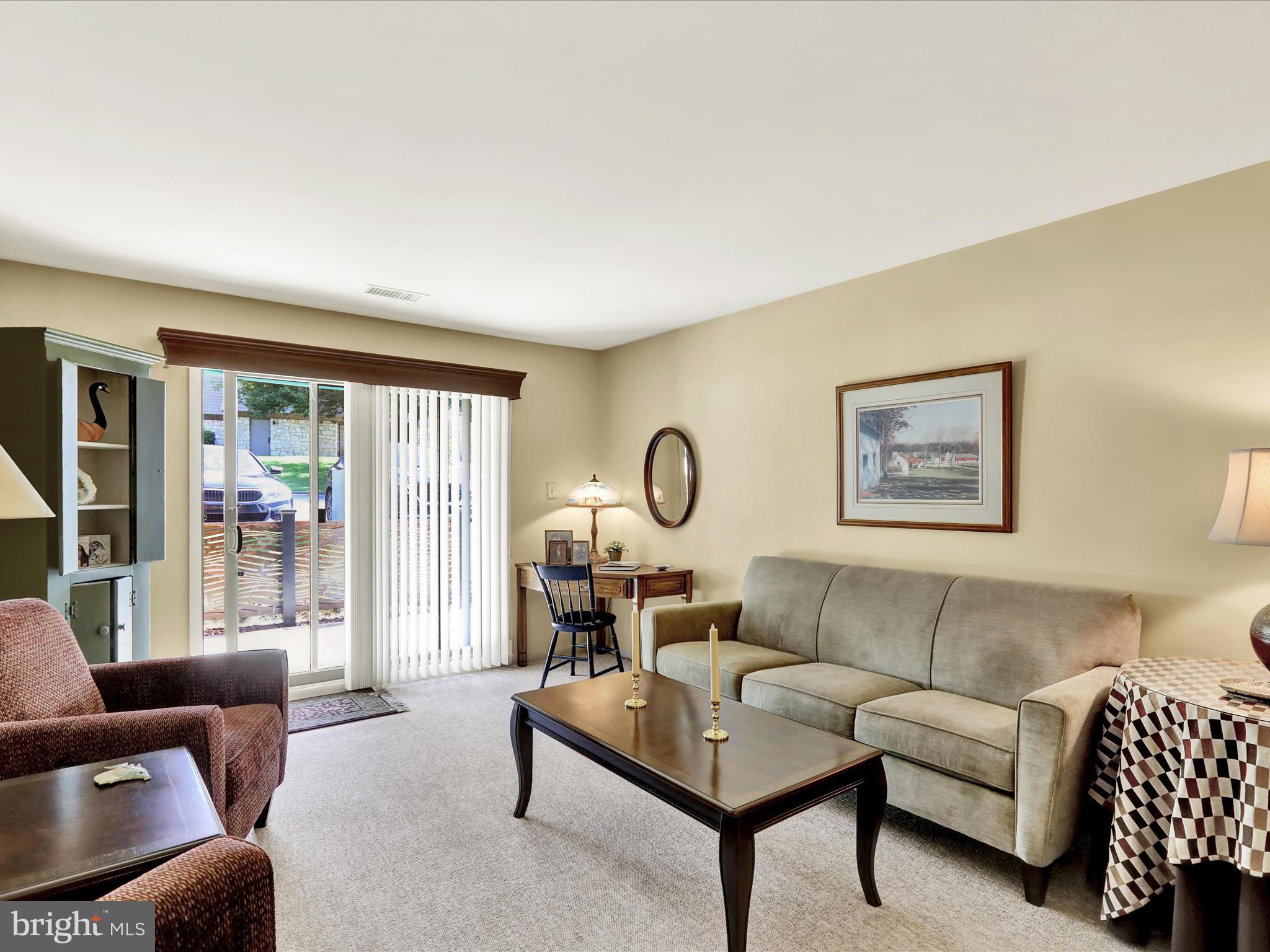 1801 Cambridge Avenue, Unit B4 Wyomissing, PA 19610 - Photo 1 of 27 a living room with furniture and a large window