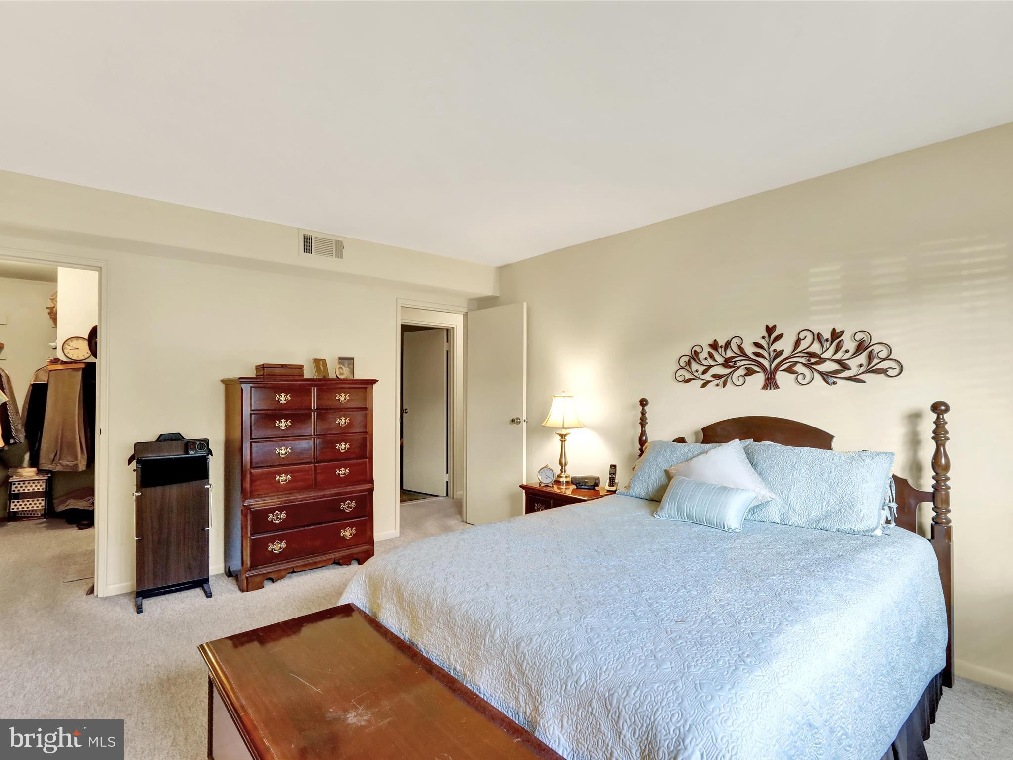 1801 Cambridge Avenue, Unit B4 Wyomissing, PA 19610 - Photo 11 of 27 a bedroom with a bed and dresser