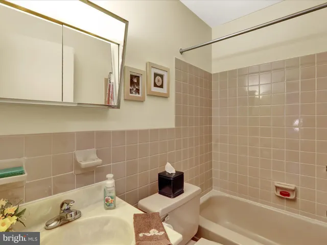 a bathroom with a bathtub and sink