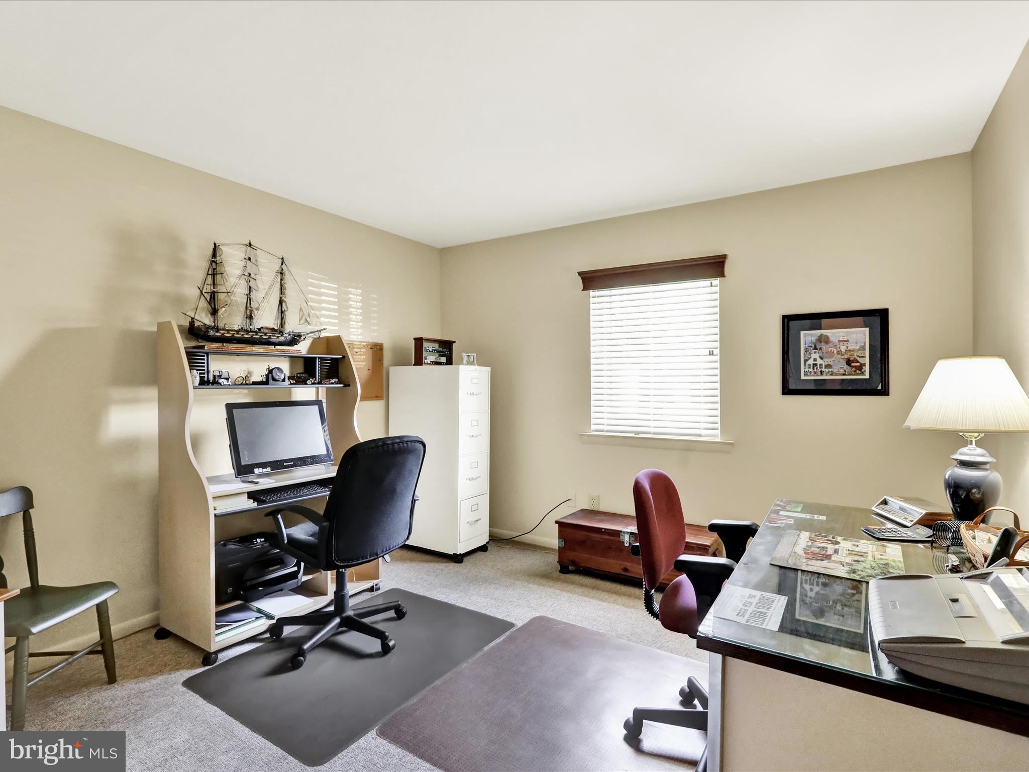 1801 Cambridge Avenue, Unit B4 Wyomissing, PA 19610 - Photo 16 of 27 a view of a workspace with furniture and a window
