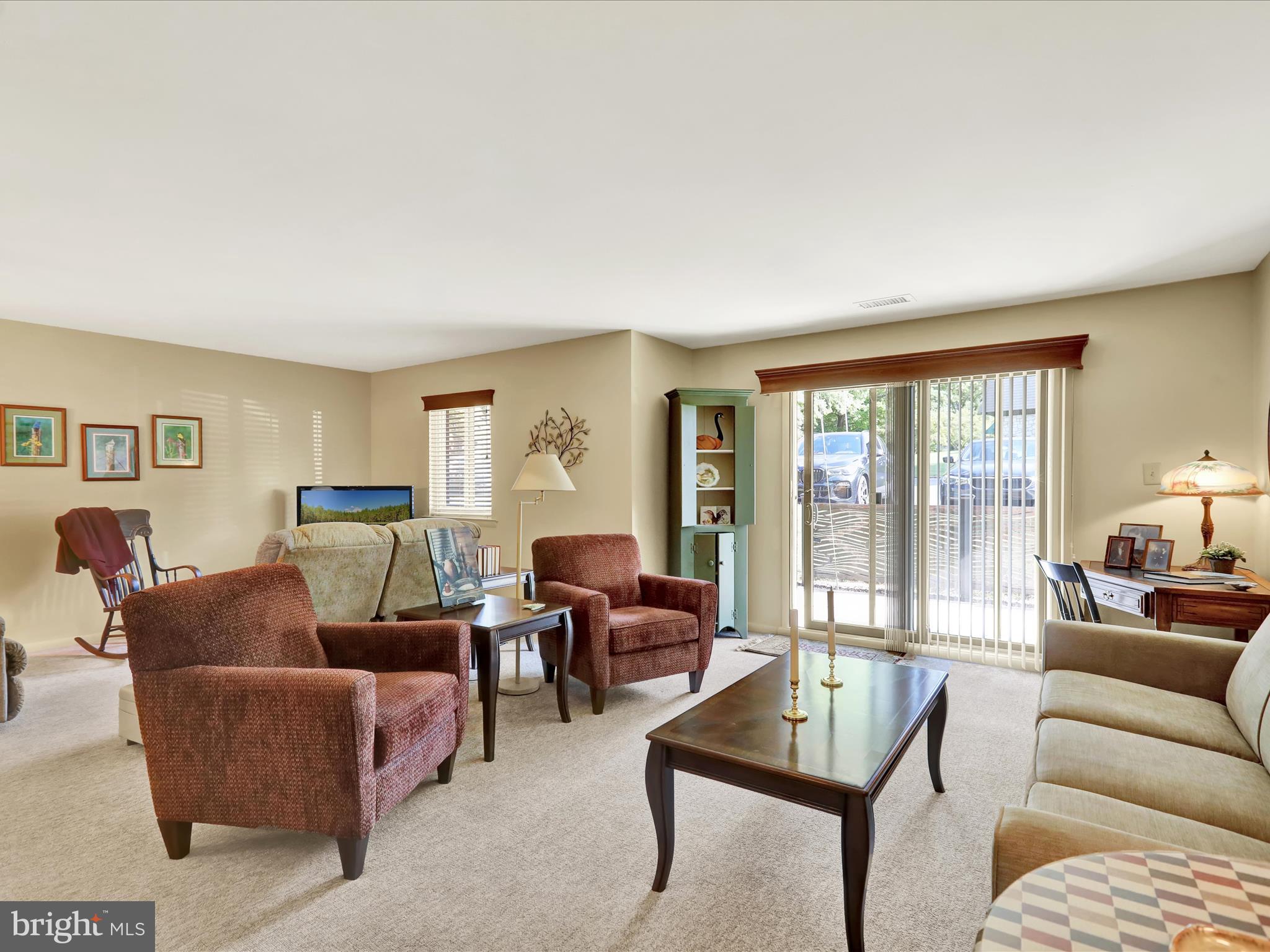 1801 Cambridge Avenue, Unit B4 Wyomissing, PA 19610 - Photo 2 of 27 a living room with furniture and a window