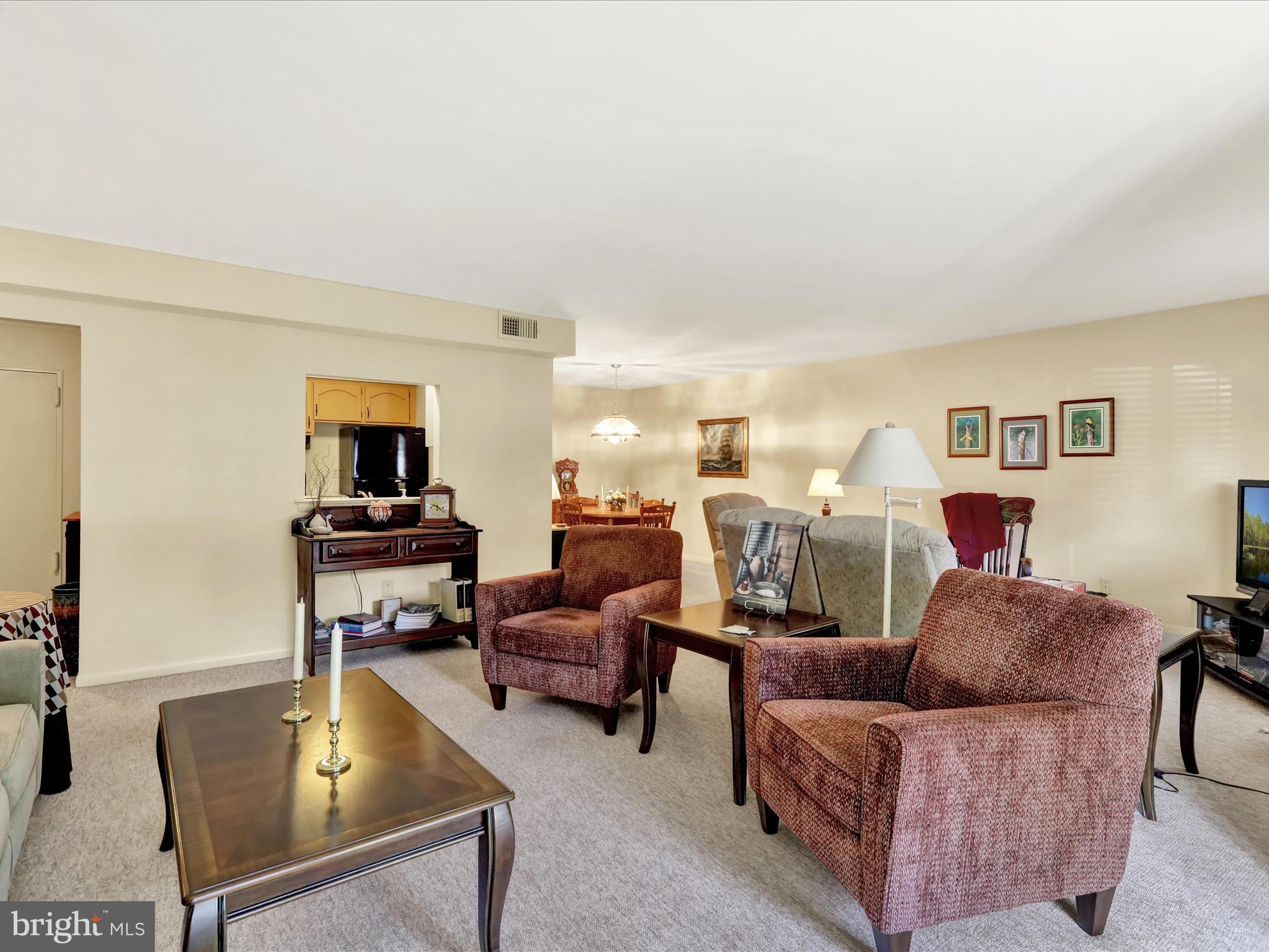 1801 Cambridge Avenue, Unit B4 Wyomissing, PA 19610 - Photo 3 of 27 a living room with furniture and a flat screen tv