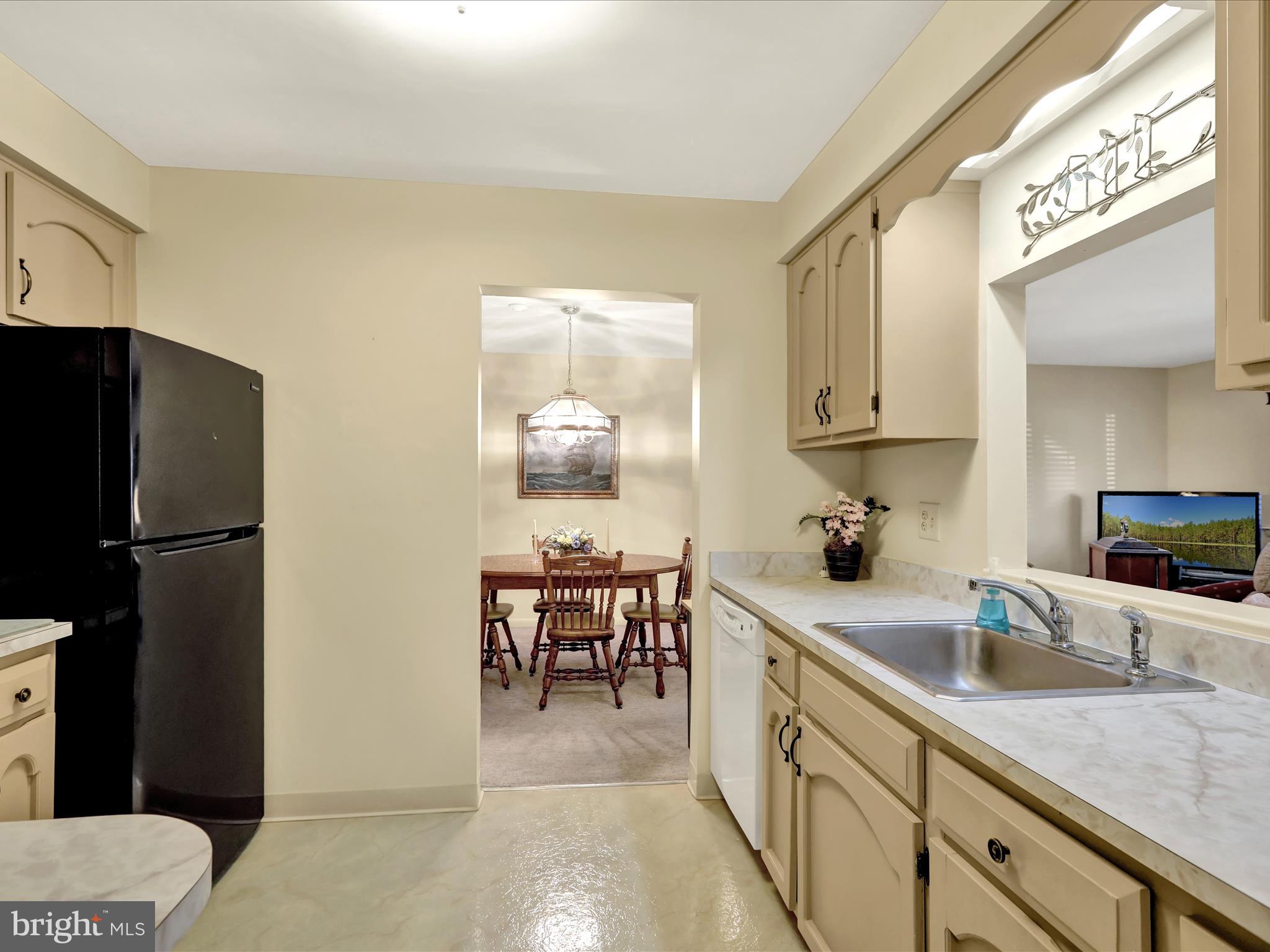 1801 Cambridge Avenue, Unit B4 Wyomissing, PA 19610 - Photo 5 of 27 a kitchen with a sink cabinets and refrigerator