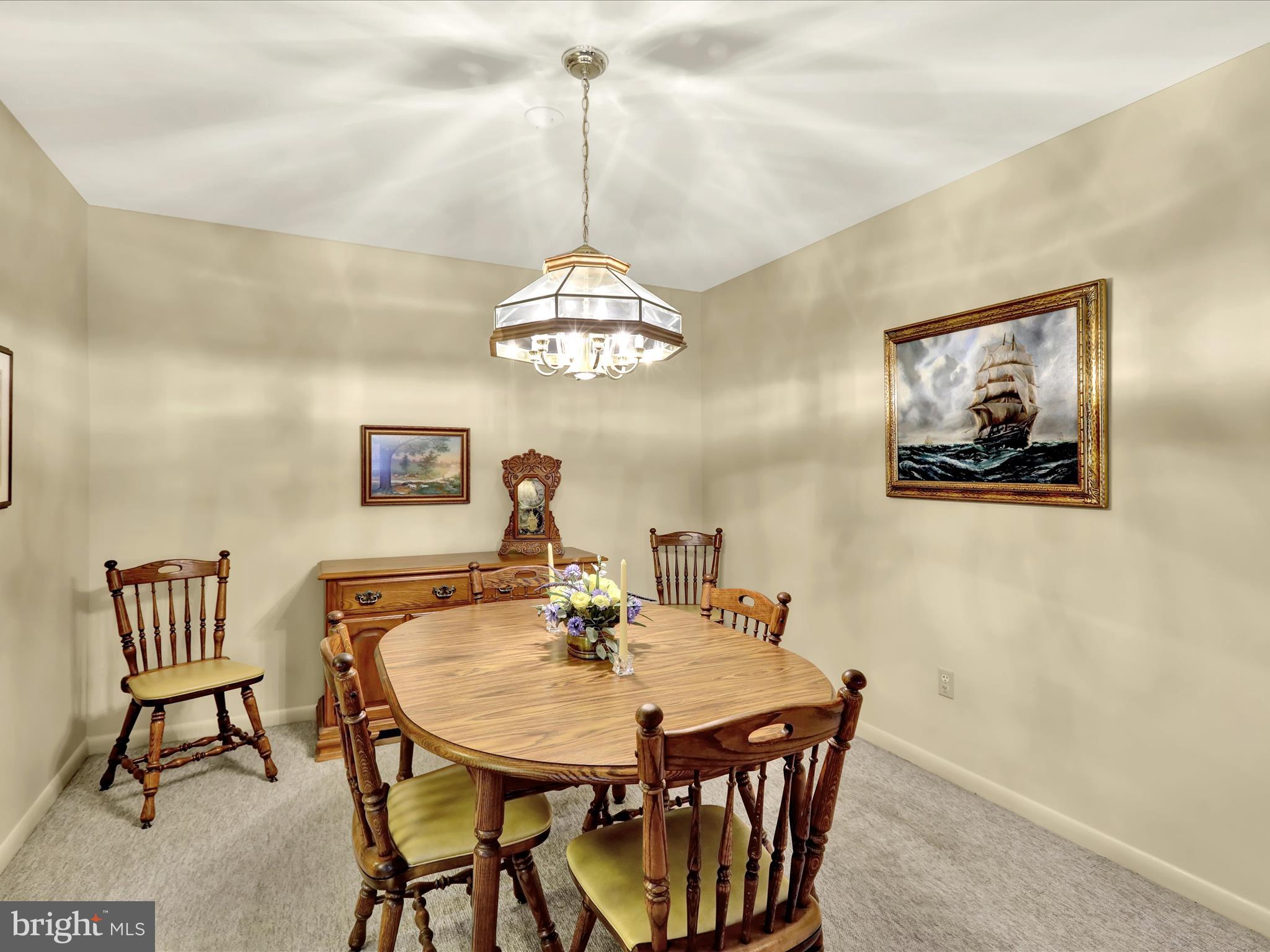1801 Cambridge Avenue, Unit B4 Wyomissing, PA 19610 - Photo 9 of 27 a view of a dining room with furniture and chandelier