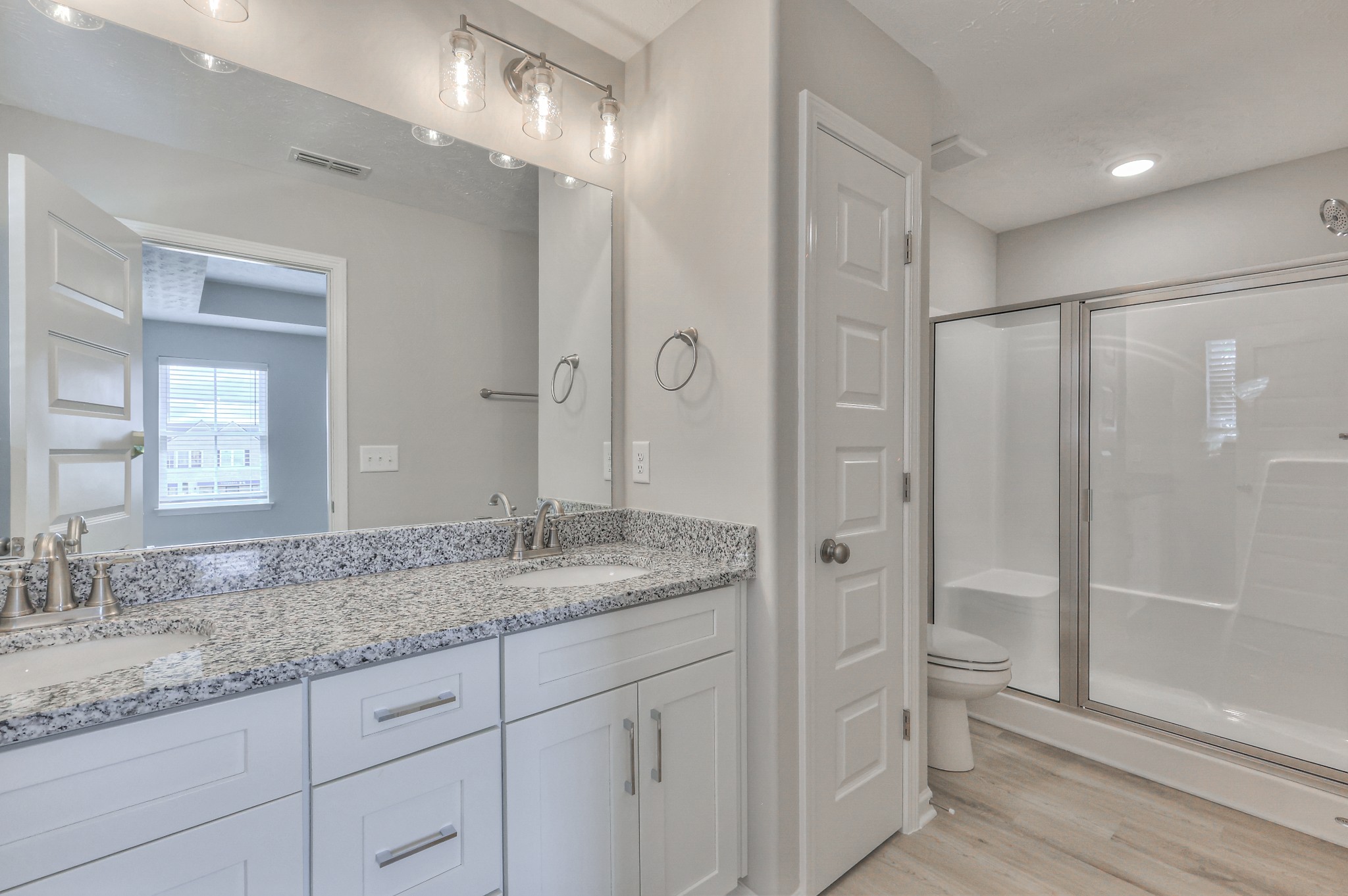 36 Hardwood Road Normandy, TN 37360 - Photo 17 of 29 a bathroom with a granite countertop sink two mirror and shower