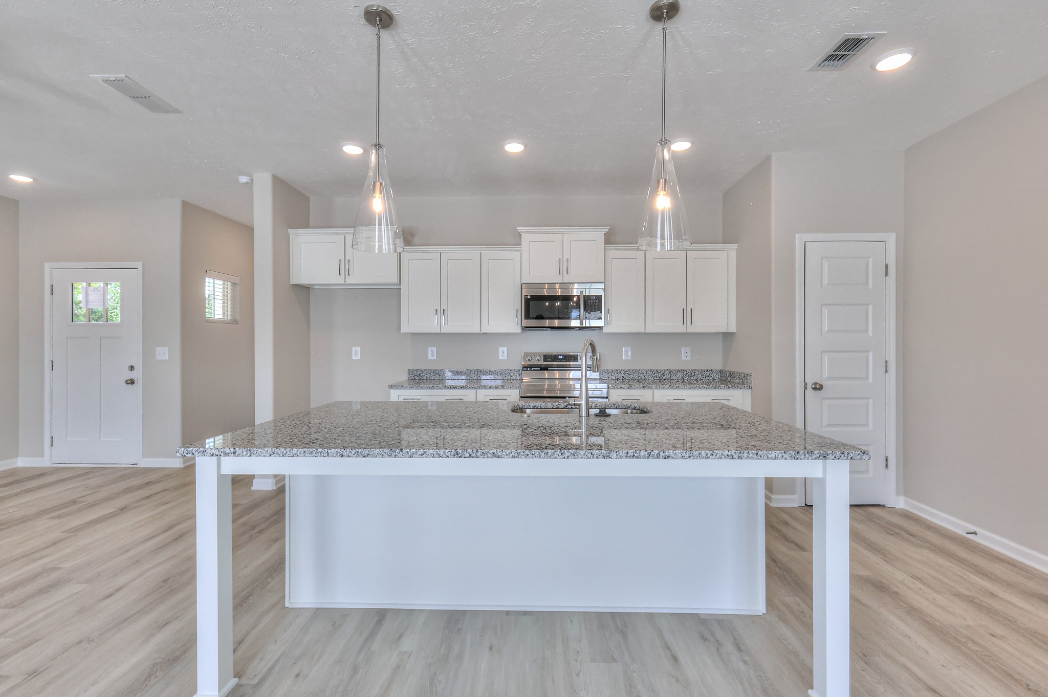 36 Hardwood Road Normandy, TN 37360 - Photo 9 of 29 a large kitchen with granite countertop a island a sink stainless steel appliances and cabinets