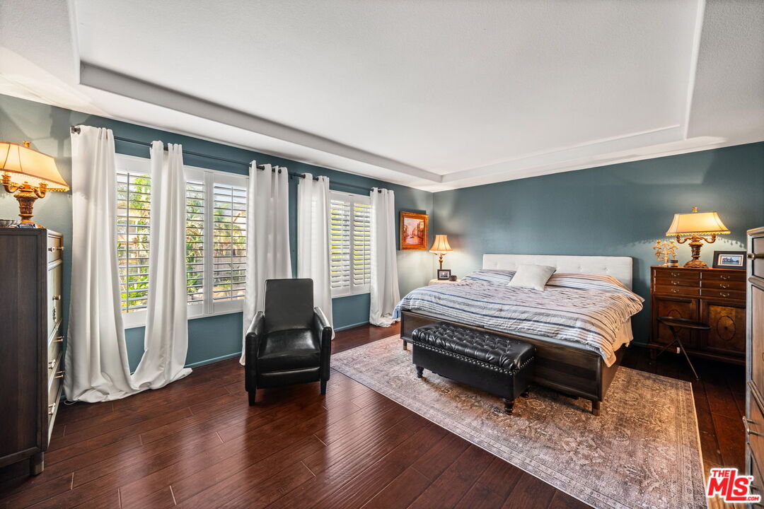 12164 Wembley Court Rancho Cucamonga, CA 91739 - Photo 24 of 42 a bedroom with a bed and large window