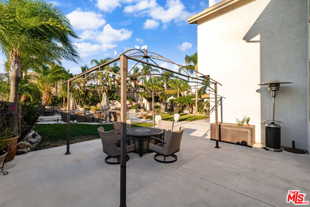 12164 Wembley Court Rancho Cucamonga, CA 91739 - Photo 36 of 42 a view of a patio with a table and chairs
