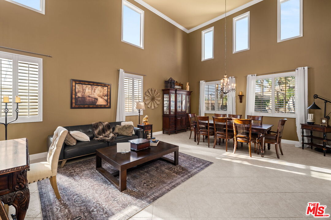 12164 Wembley Court Rancho Cucamonga, CA 91739 - Photo 5 of 42 a living room with furniture and a large window