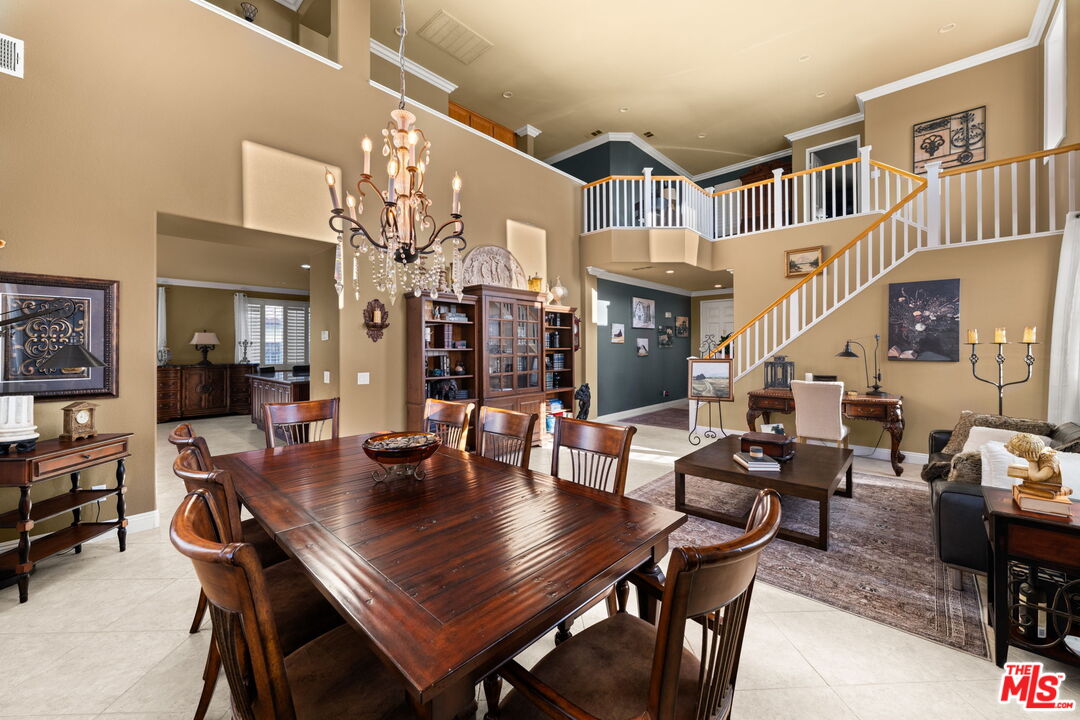 12164 Wembley Court Rancho Cucamonga, CA 91739 - Photo 7 of 42 a view of a dining room with furniture and a chandelier