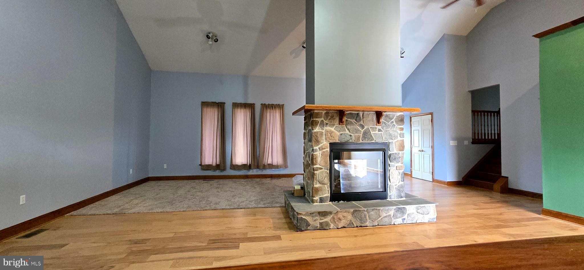 6859 Wertzville Road Enola, PA 17025 - Photo 13 of 60 a room with fireplace and wooden floor