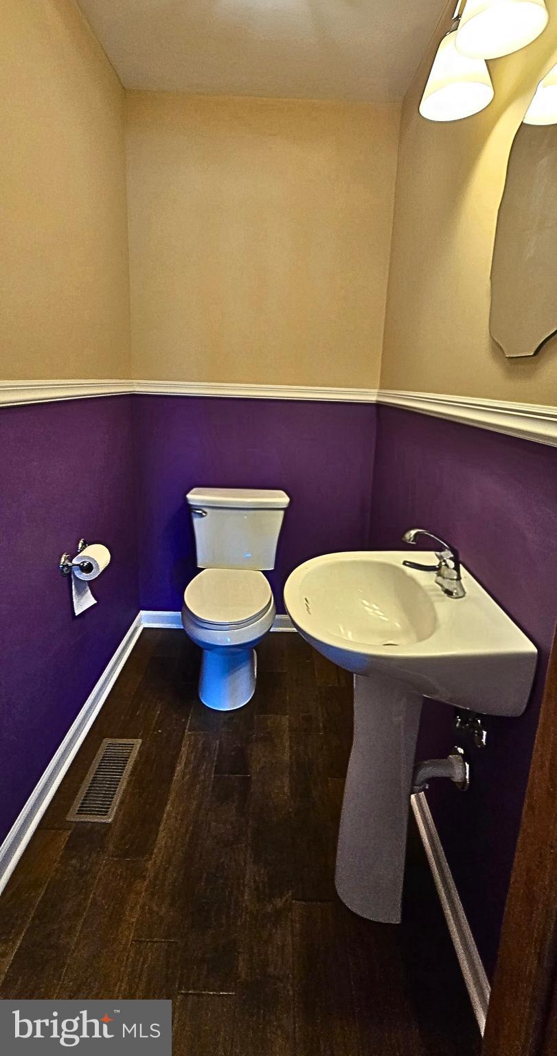 6859 Wertzville Road Enola, PA 17025 - Photo 15 of 60 a bathroom with a sink mirror and toilet