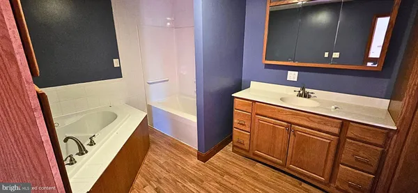 a view of a room with a wooden door