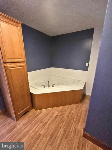 a bathroom with a toilet a sink and bathtub