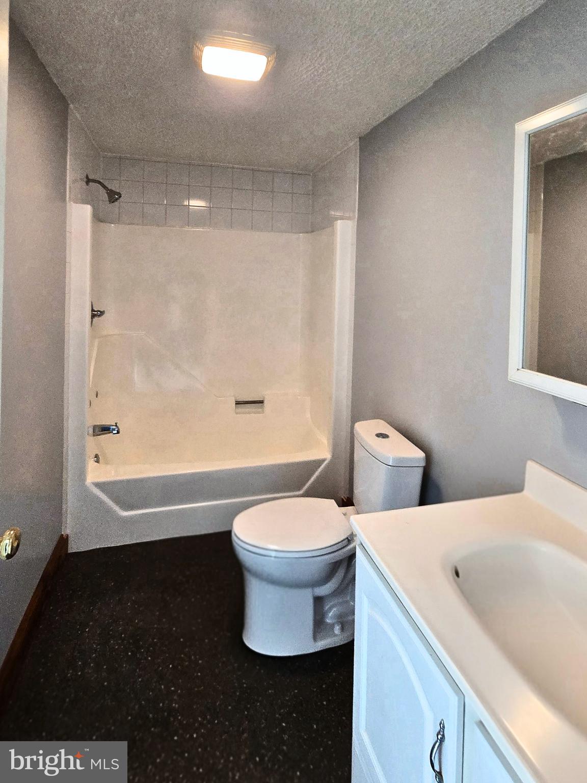 6859 Wertzville Road Enola, PA 17025 - Photo 36 of 60 a bathroom with a toilet a sink and bathtub