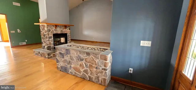 a view of a living room with fireplace