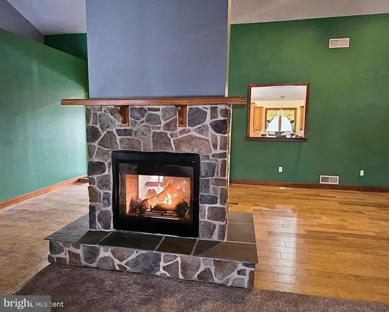 a view of a livingroom with furniture and a fireplace