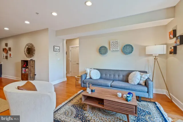 a living room with furniture and a rug