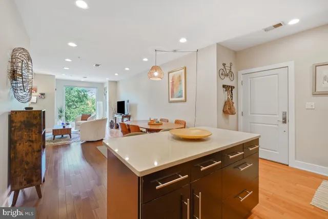 a view of kitchen island with furniture and wooden floor