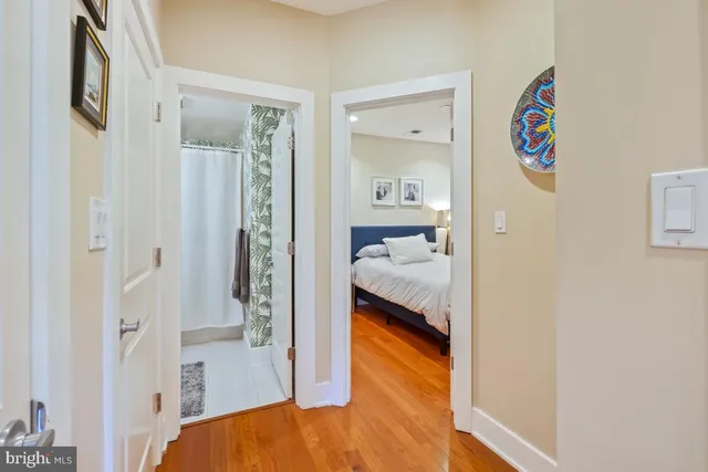 a bedroom with a bed and a view of bathroom