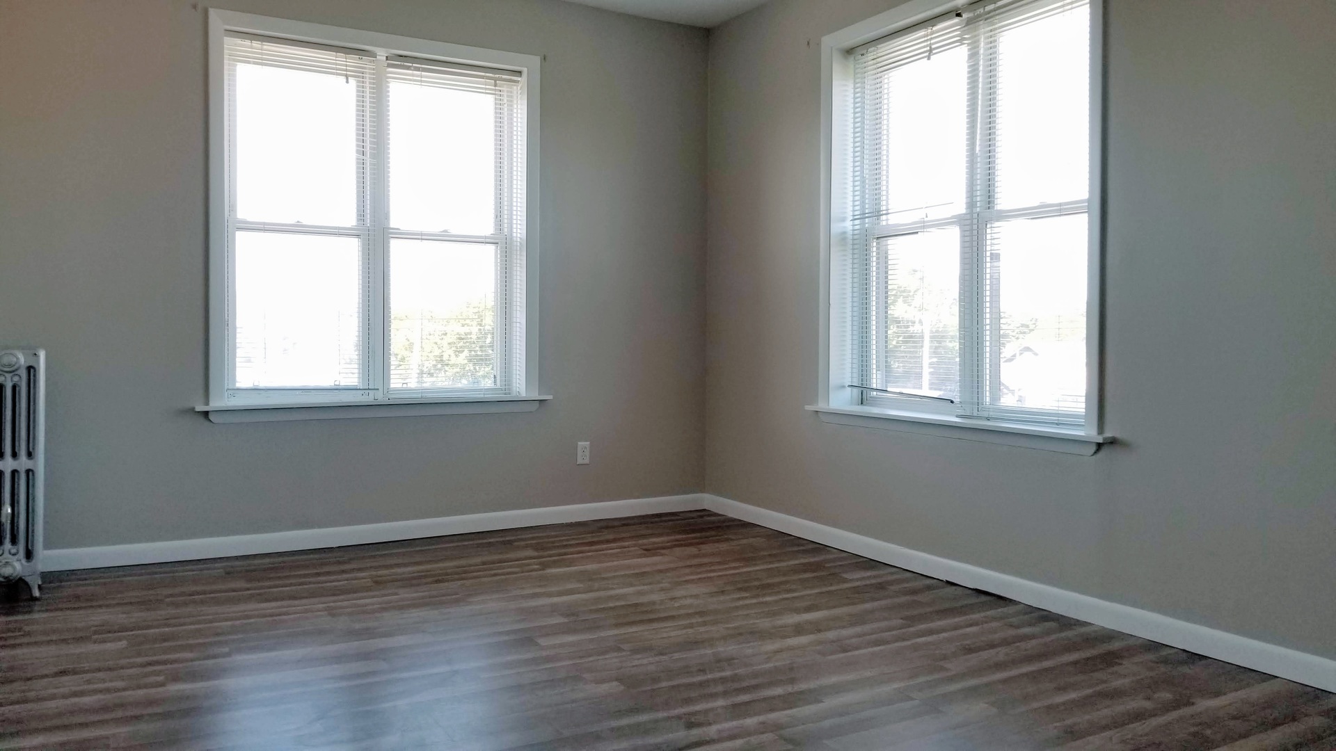 4764 North Virginia Avenue, Unit 306 Chicago, IL 60625 - Photo 11 of 16 an empty room with wooden floor and windows