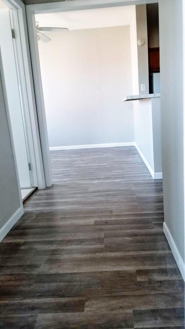 4764 North Virginia Avenue, Unit 306 Chicago, IL 60625 - Photo 10 of 16 a view of empty room with wooden floor