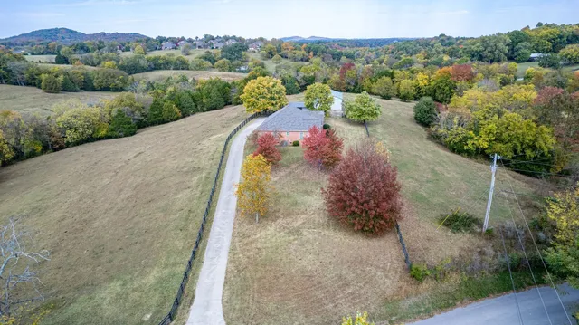 an aerial view of a house with a garden