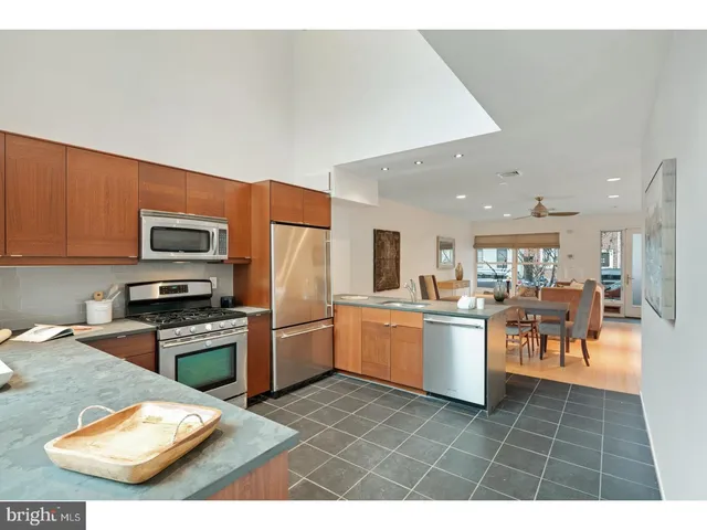 a kitchen with a sink cabinets and stainless steel appliances