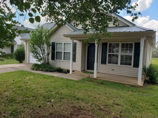 front view of a house with a yard