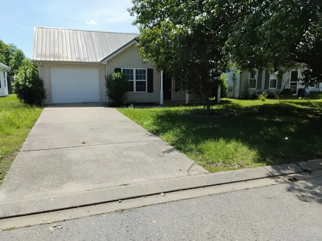a view of a backyard of the house
