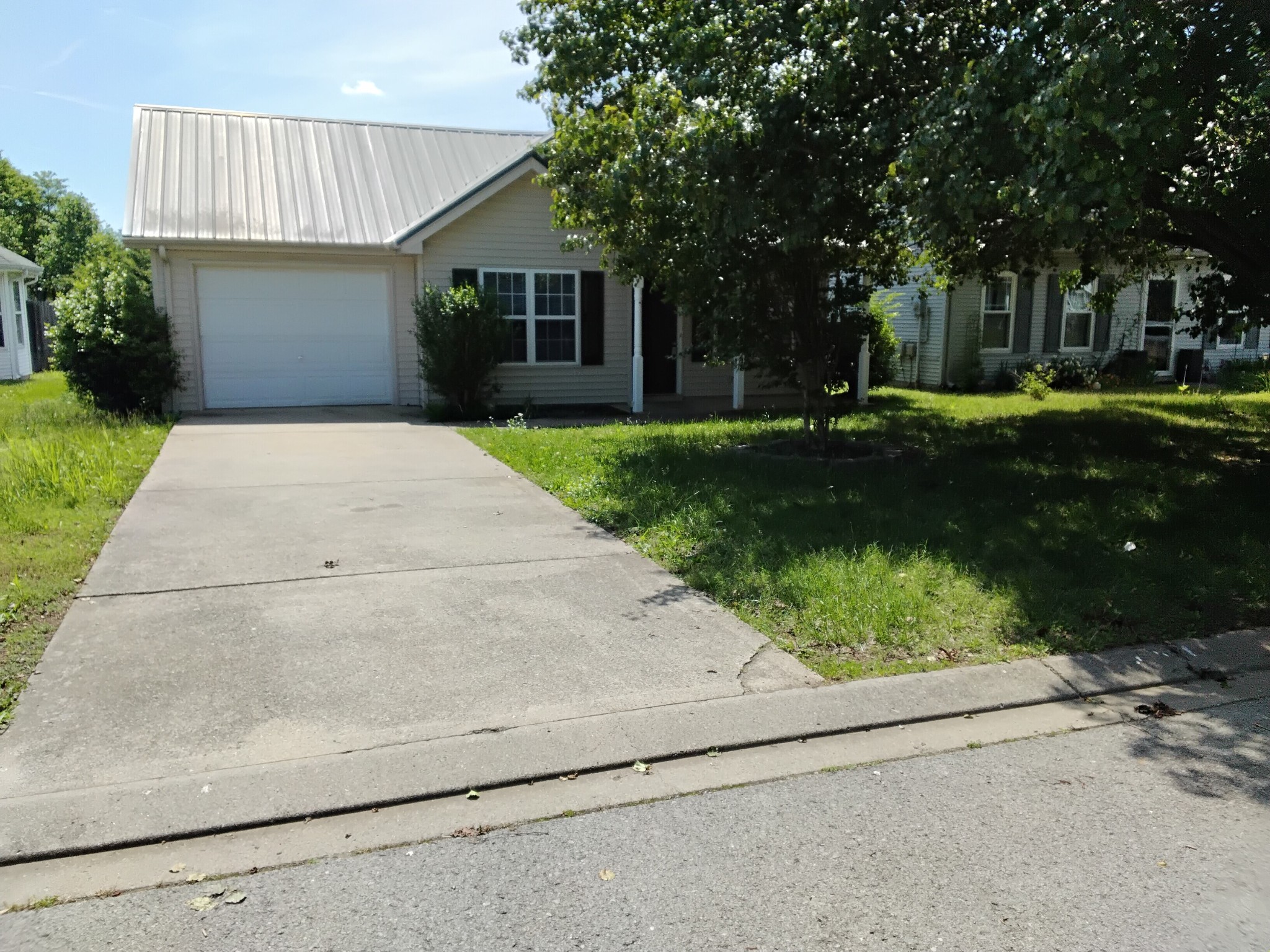2743 Painted Pony Drive Murfreesboro, TN 37128 - Photo 13 of 14 a front view of a house with a garden and trees