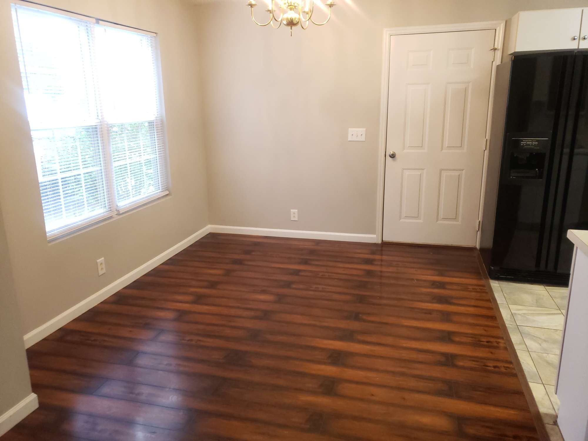 2743 Painted Pony Drive Murfreesboro, TN 37128 - Photo 3 of 14 a view of an empty room with wooden floor and a window