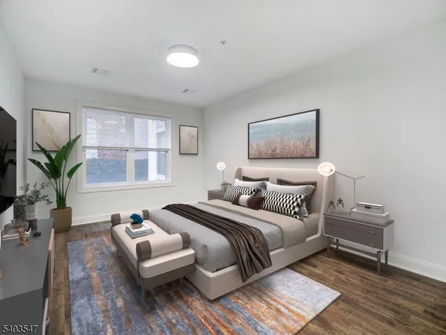 a bedroom with bed and a couch