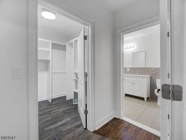 a view of a bathroom with a sink and a mirror