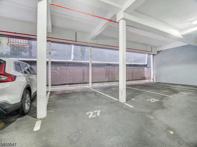 a view of an empty room with a fireplace