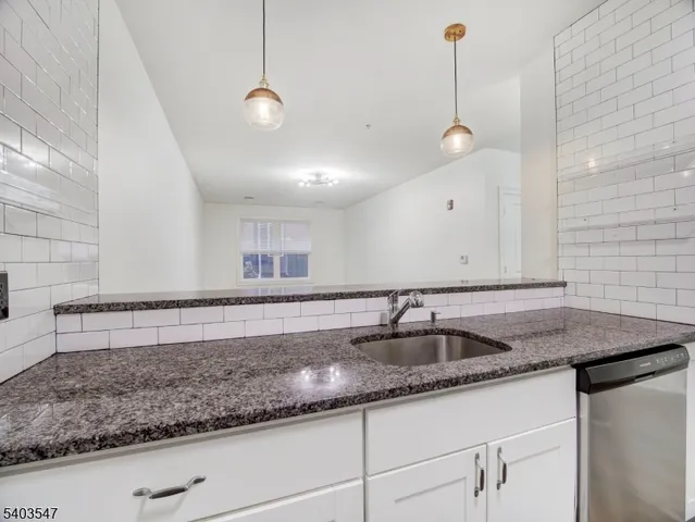 a kitchen with sink and window