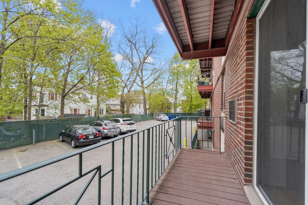 804 Centre Street, Unit 104 Boston, MA 02130 - Photo 17 of 32 a view of a house and a balcony