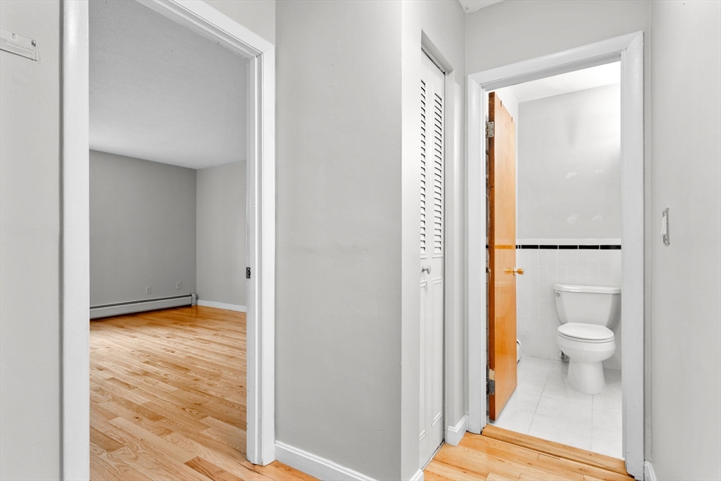 804 Centre Street, Unit 104 Boston, MA 02130 - Photo 10 of 32 a en suite bathroom with a toilet