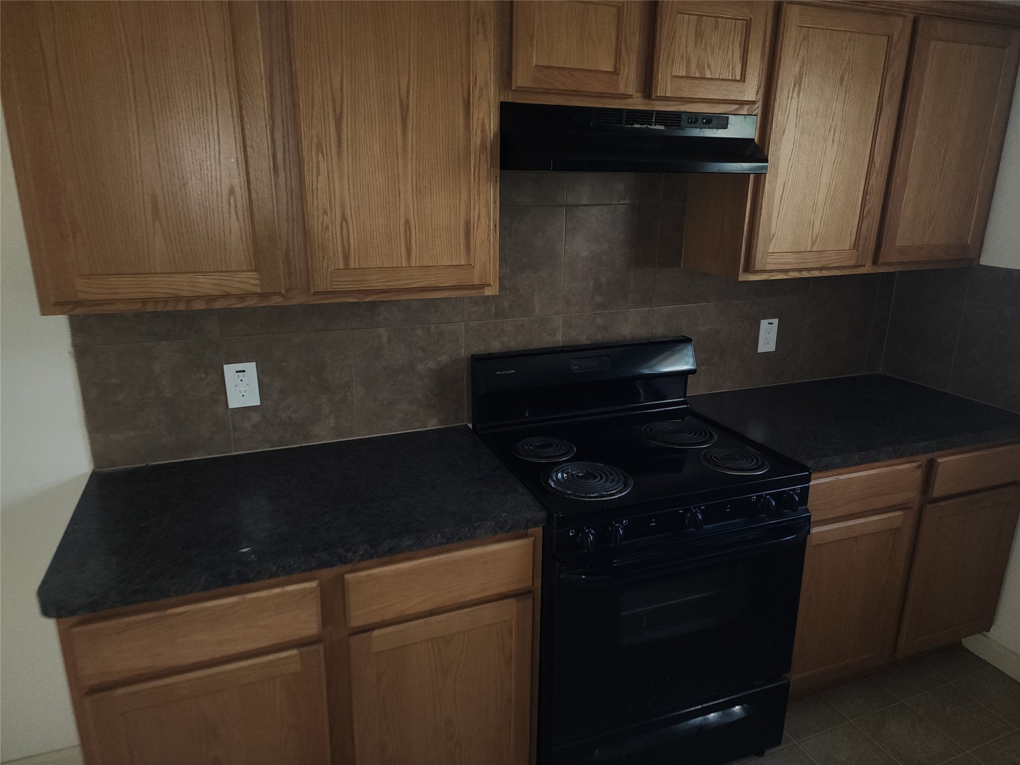 315 20th Street Dickinson, TX 77539 - Photo 12 of 19 a close view of a stove and microwave in the kitchen