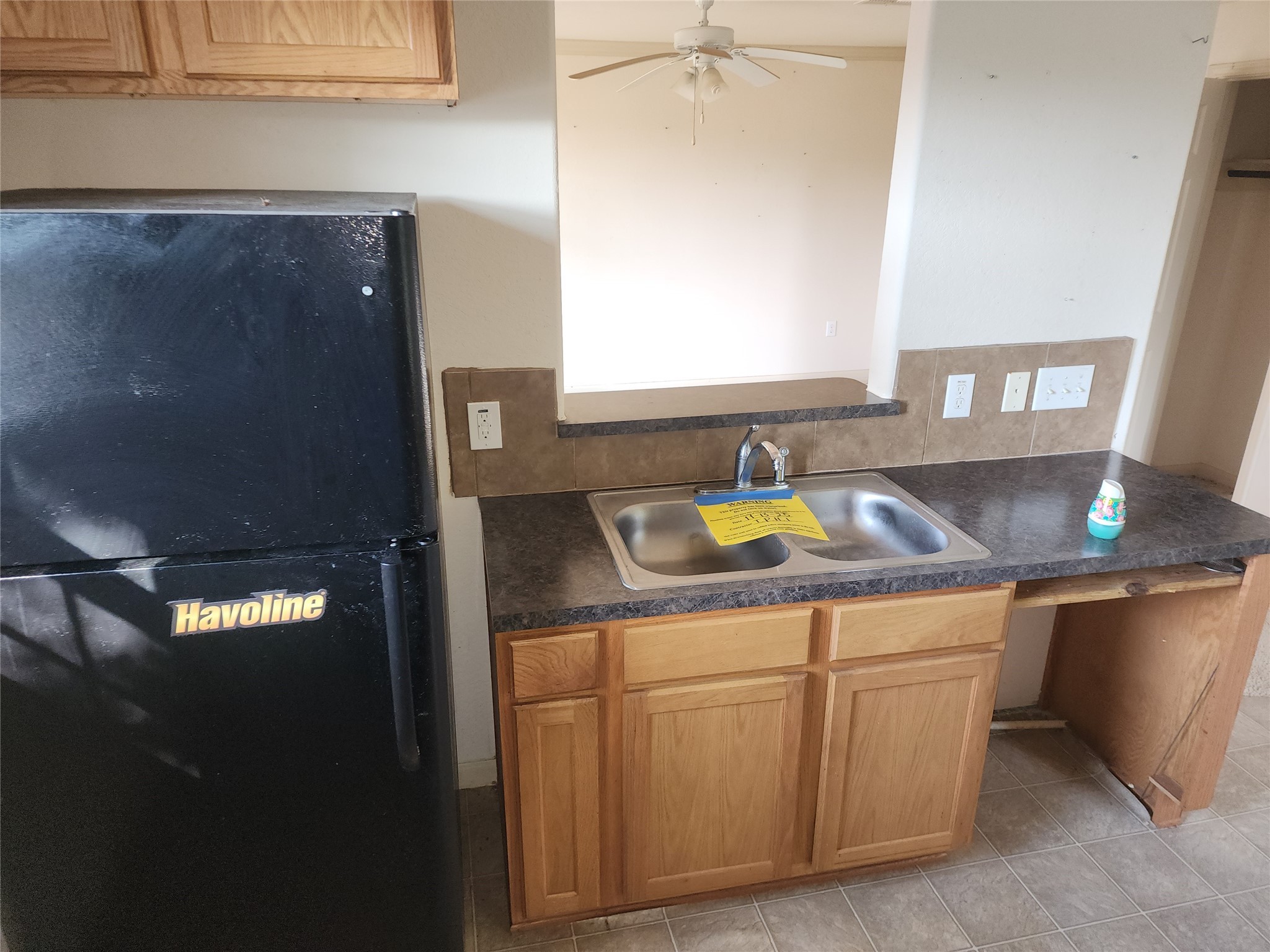 315 20th Street Dickinson, TX 77539 - Photo 13 of 19 a kitchen with a sink and cabinets
