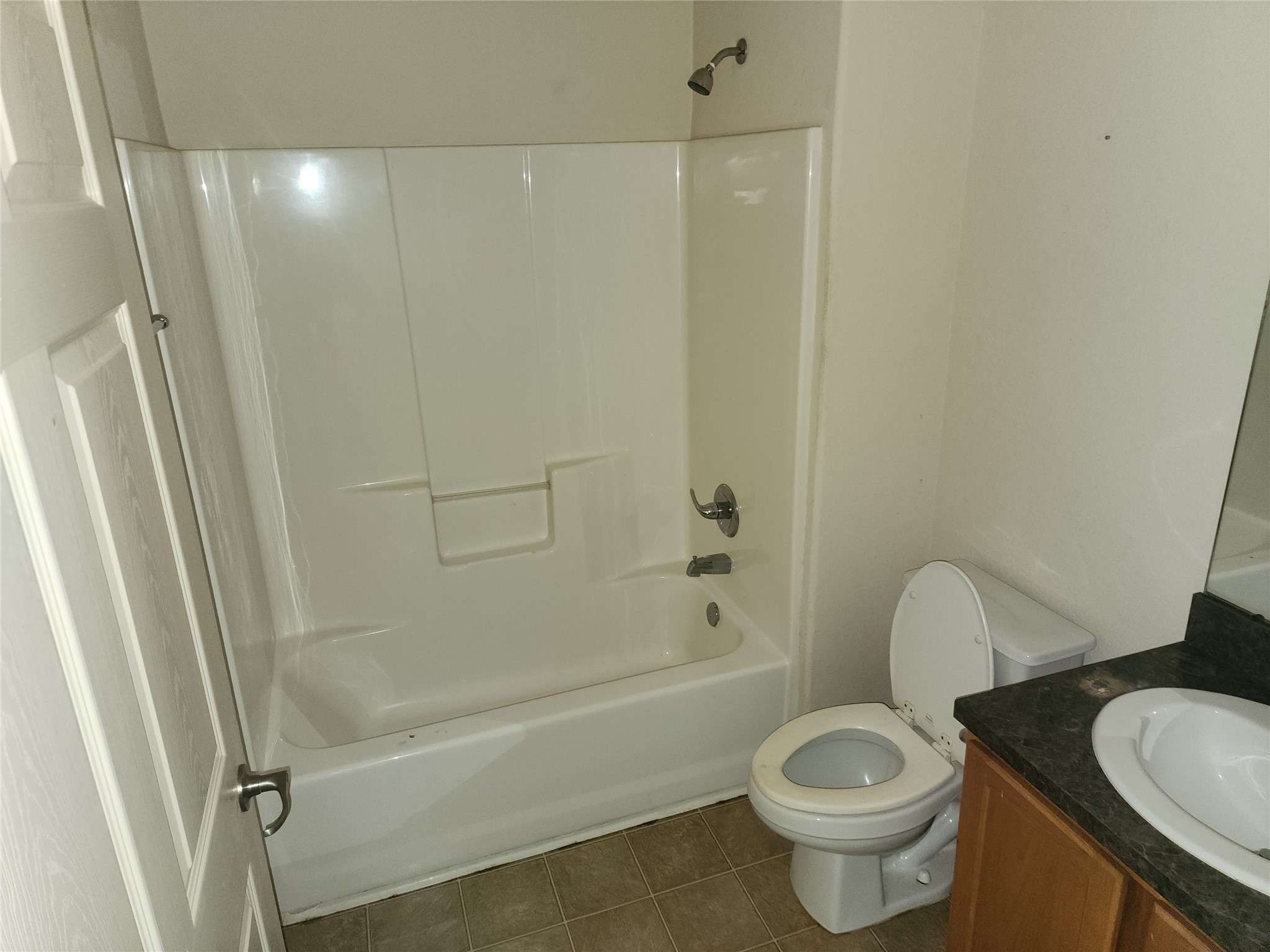 315 20th Street Dickinson, TX 77539 - Photo 16 of 19 a bathroom with a sink a toilet and shower