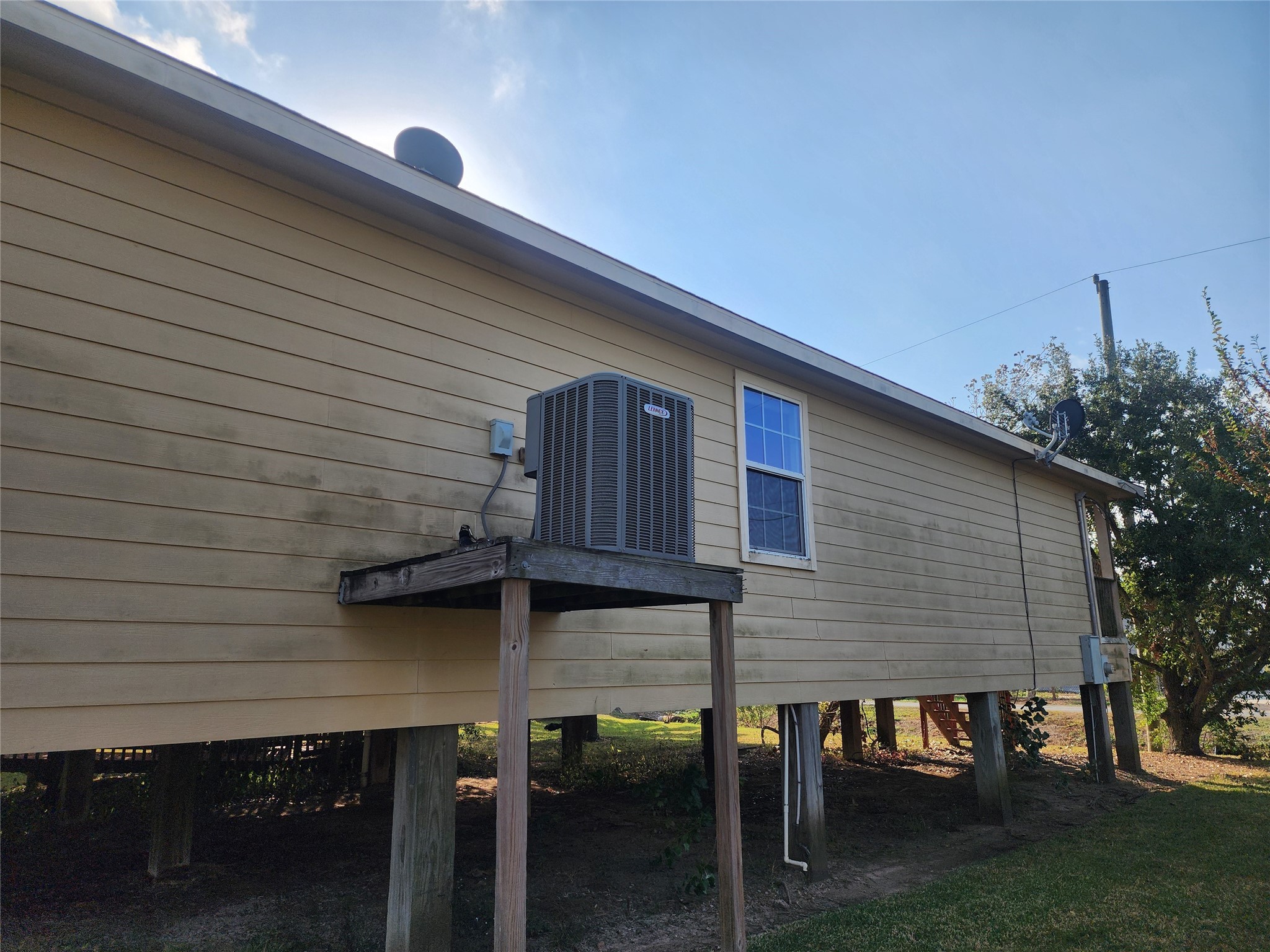 315 20th Street Dickinson, TX 77539 - Photo 3 of 19 a front view of house with yard outdoor seating and barbeque oven