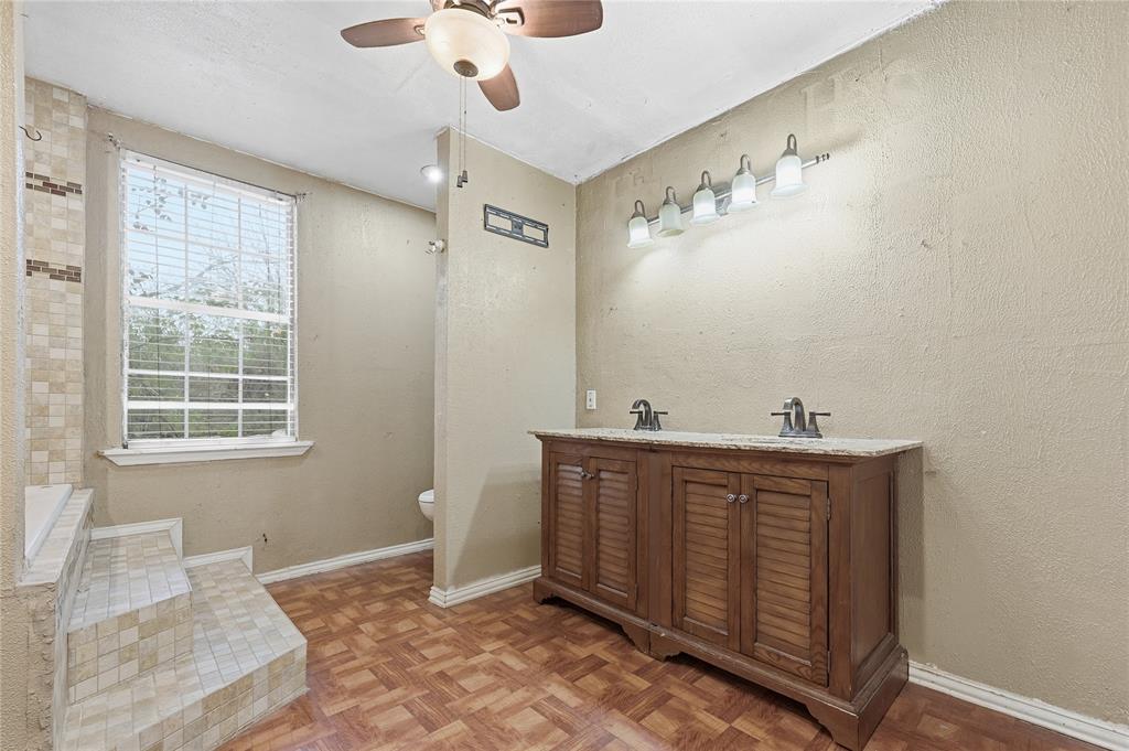 414 Thomas Street Terrell, TX 75160 - Photo 14 of 20 a view of a bathroom with sink and mirror